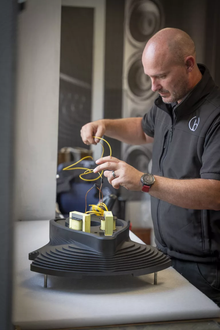 Wilson fitting the inductors to the huge 35kg foot of the Eminence loudspeaker. The foot is hewn from a 120kg billet of aluminium over 5 hours all in the Wilson Benesch CNC Suite