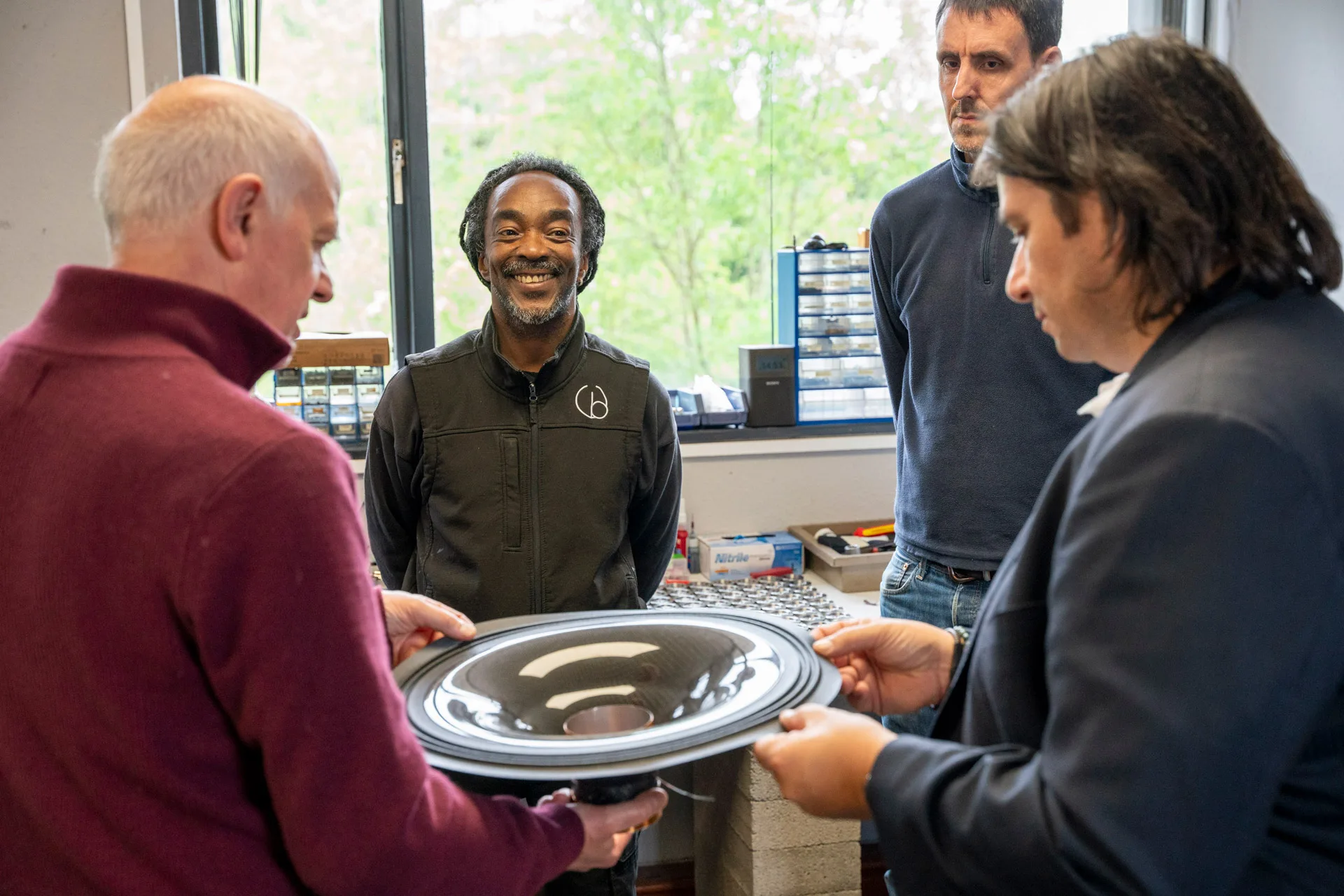 Production Technicians Mark and Richard showing George the IGx production and the carbon-PTFE diaphragm that Wilson Benesch manufactures